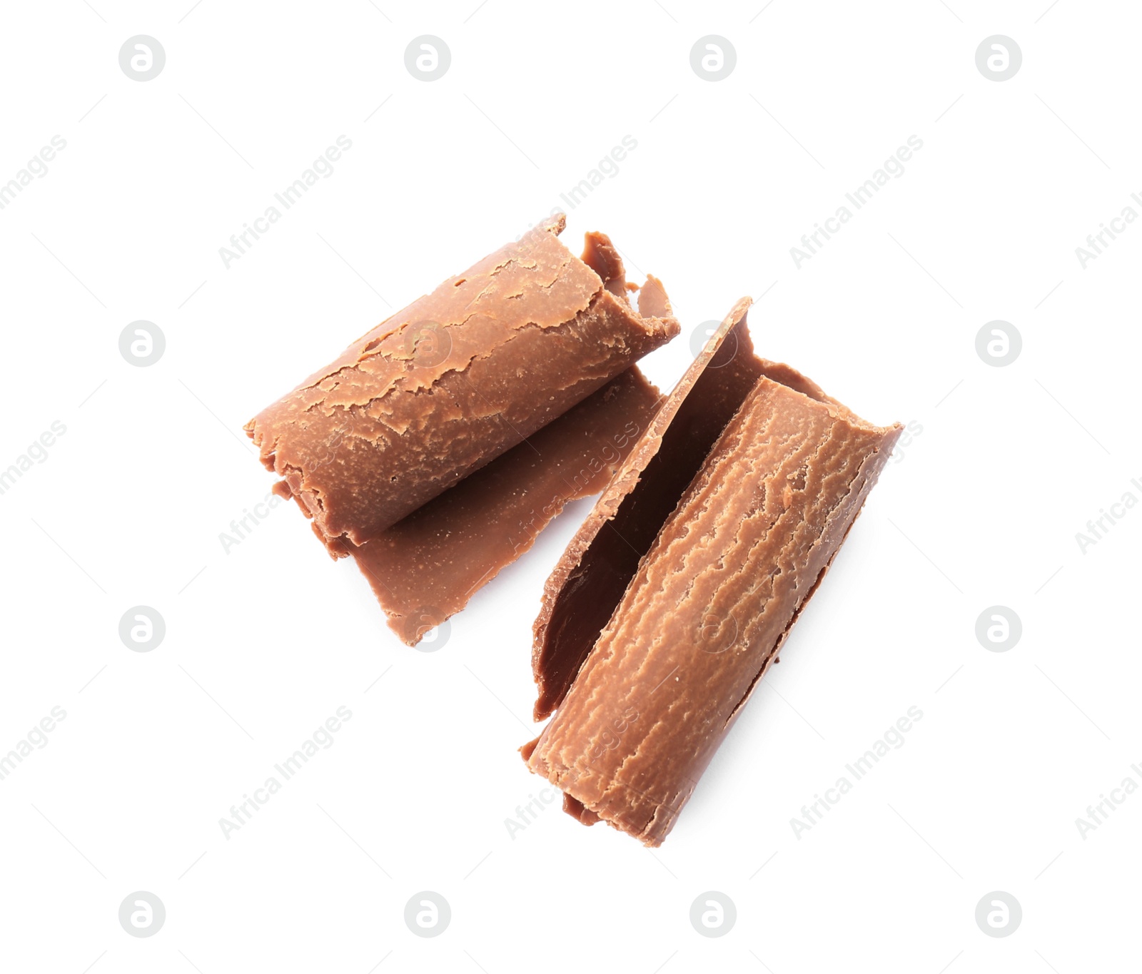 Photo of Delicious milk chocolate curls on white background