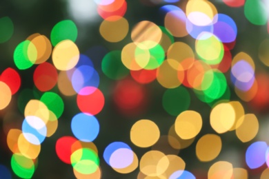 Photo of Blurred view of glowing Christmas lights as background. Festive mood