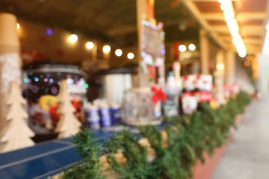 Blurred view of Christmas fair stall outdoors