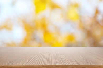 Empty wooden surface against blurred background. Bokeh effect