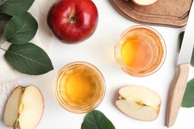 Photo of Flat lay composition with delicious apple cider on white wooden table