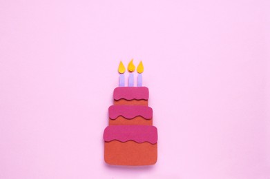 Photo of Birthday party. Paper cake on pink background, top view