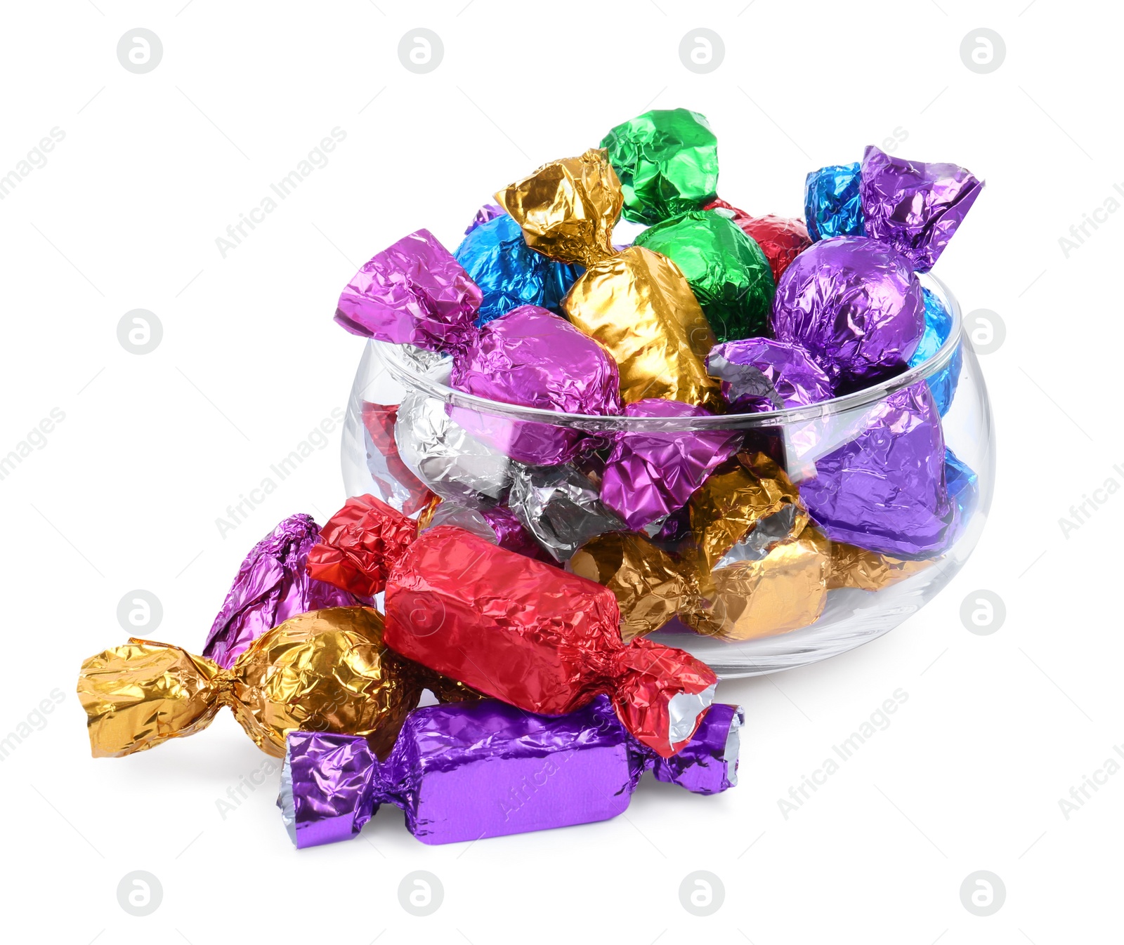 Photo of Bowl with many tasty candies in colorful wrappers isolated on white