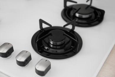 Modern built-in gas cooktop, closeup. Kitchen appliance