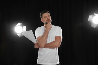 Photo of Professional actor rehearsing on stage in theatre