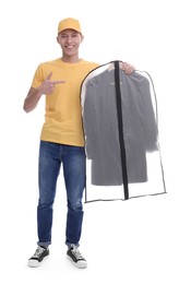 Dry-cleaning delivery. Happy courier holding garment cover with clothes on white background