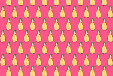 Image of Pattern of pineapple halves on bright pink background