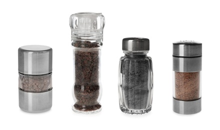 Set of shakers with black salt isolated on white 