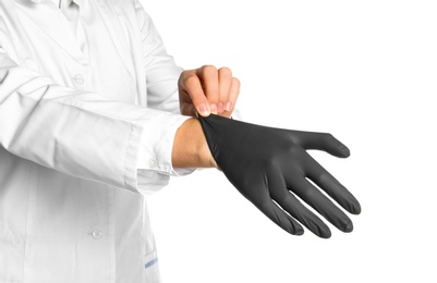 Doctor wearing medical glove on white background