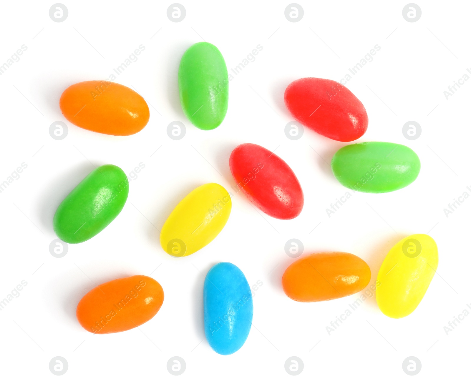 Photo of Delicious colorful jelly beans isolated on white, top view