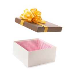 Photo of Open empty gift box with bow on white background