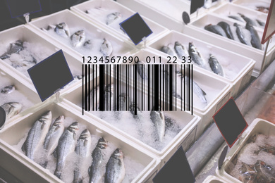 Image of Barcode and fresh fish on display with ice at wholesale market