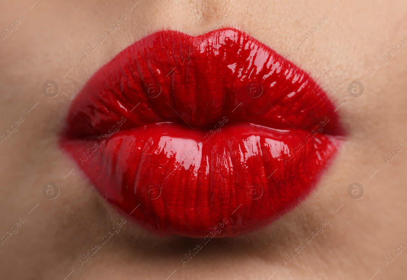 Photo of Closeup view of beautiful woman puckering lips for kiss