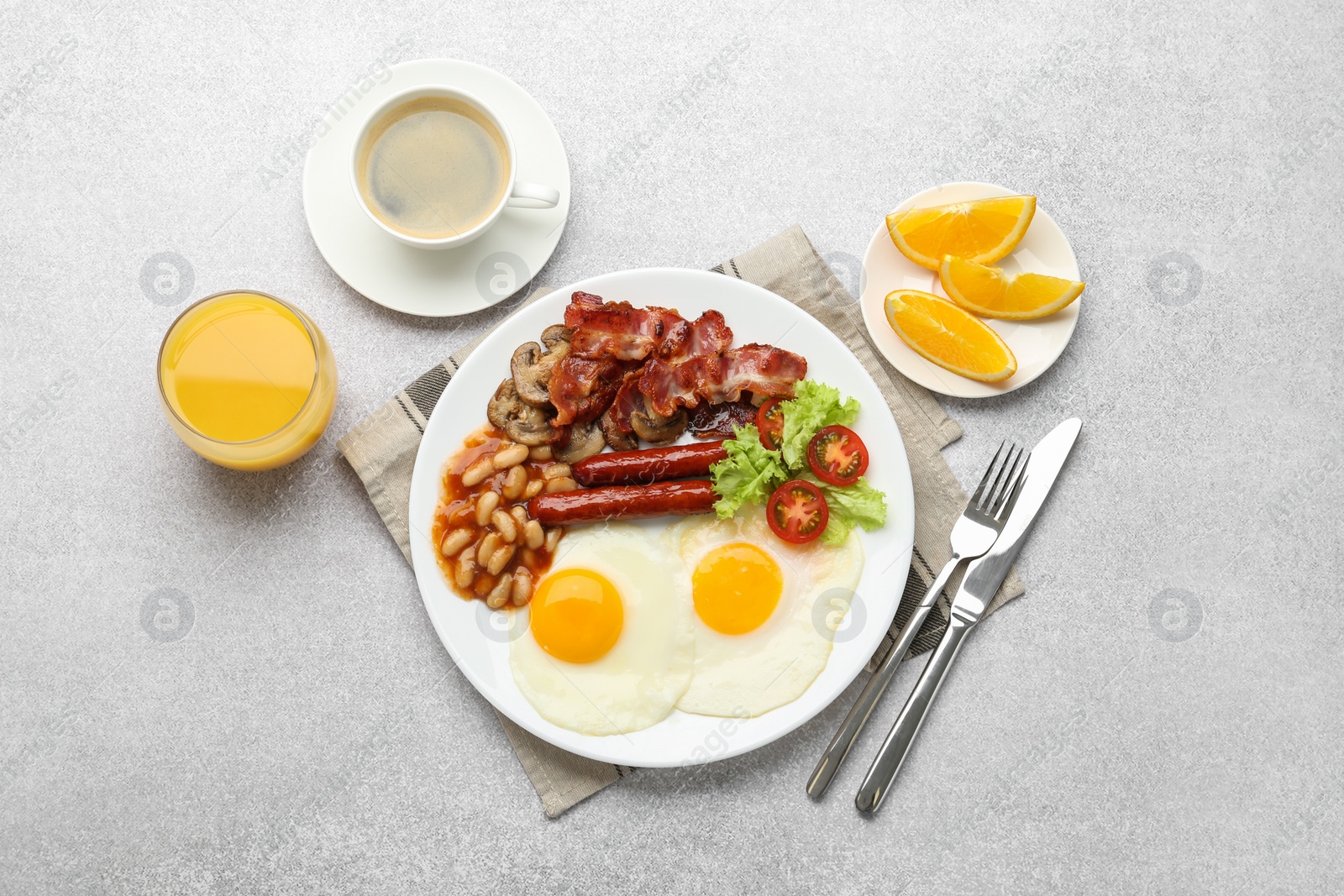 Photo of Delicious breakfast with sunny side up eggs on light table, flat lay