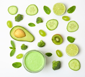 Flat lay composition with healthy detox smoothie and ingredients on light background