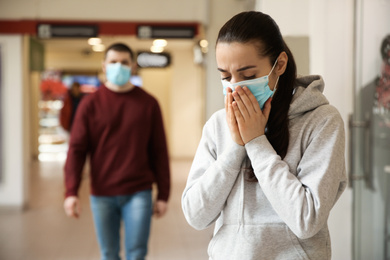 Photo of People wearing disposable masks indoors. Dangerous virus