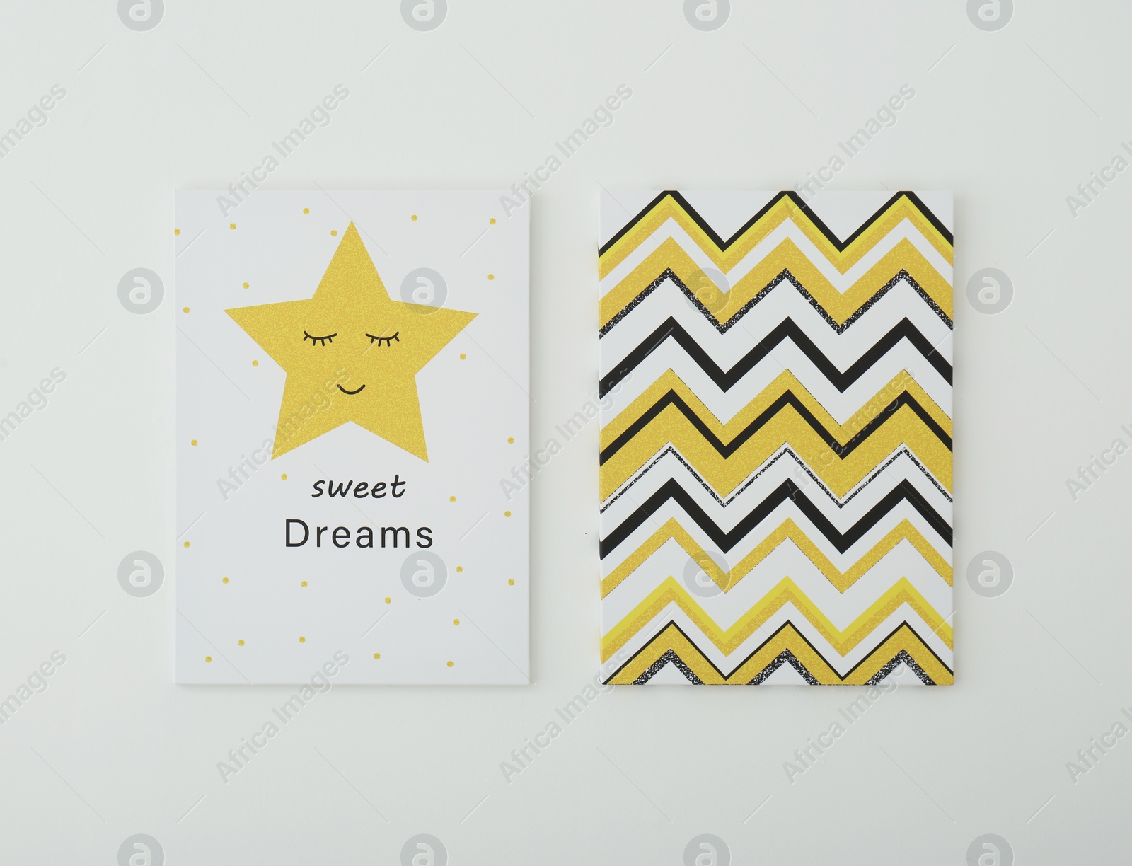 Photo of Adorable pictures of zigzag pattern and star with words SWEET DREAMS on white wall. Children's room interior elements