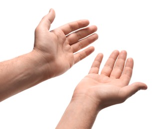 Religion. Man with open palms praying on white background, closeup