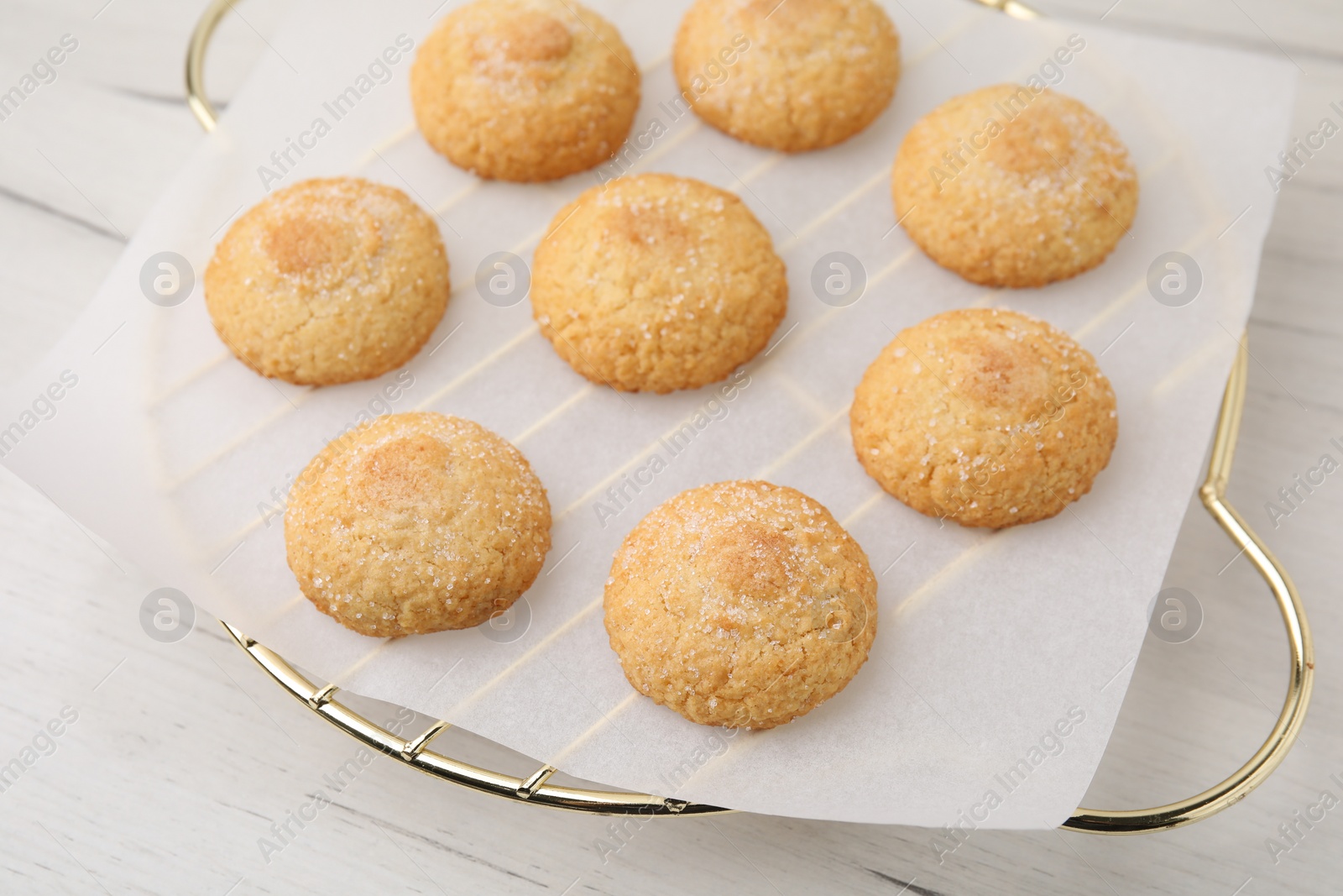 Photo of Tasty sweet sugar cookies on white wooden table, closeup