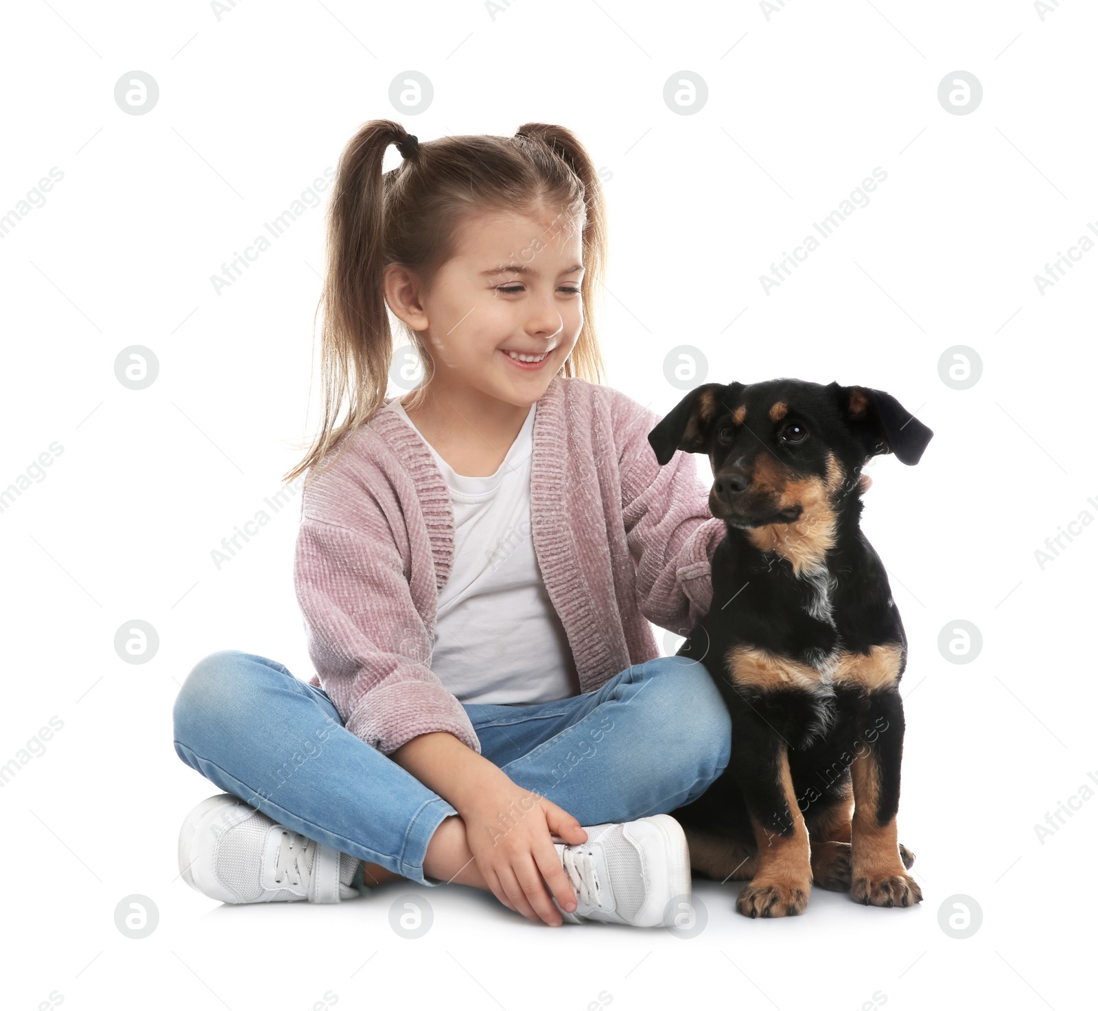 Photo of Little girl with cute puppy on white background