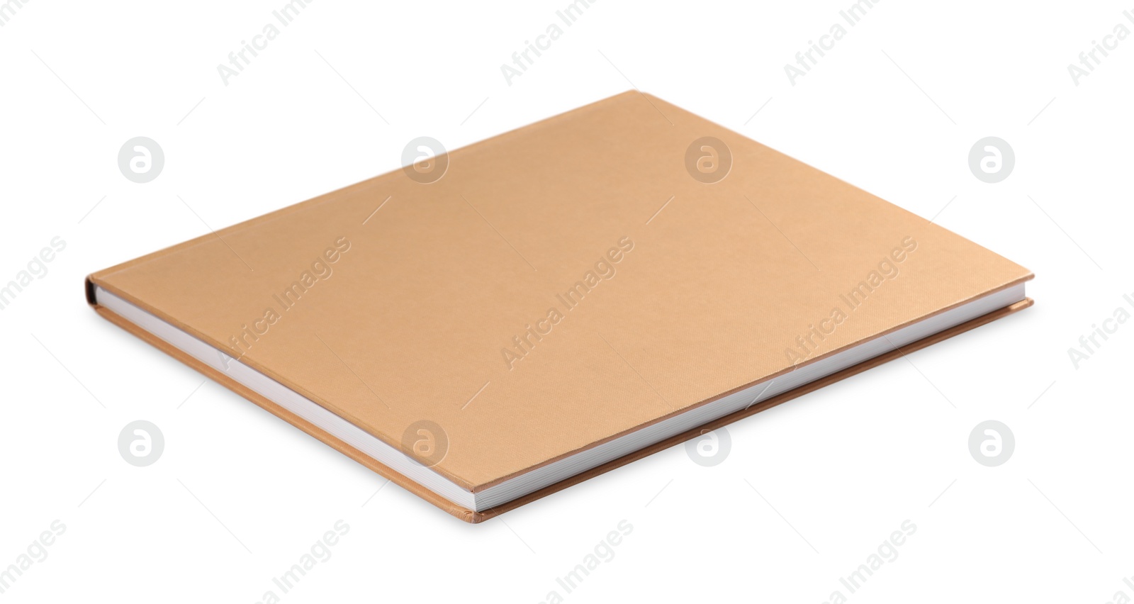 Photo of One closed beige hardcover book isolated on white