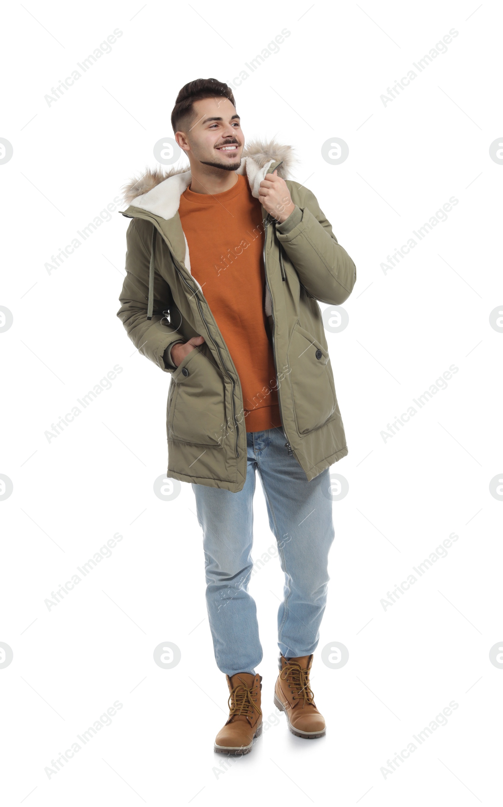 Photo of Young man wearing warm clothes on white background. Ready for winter vacation