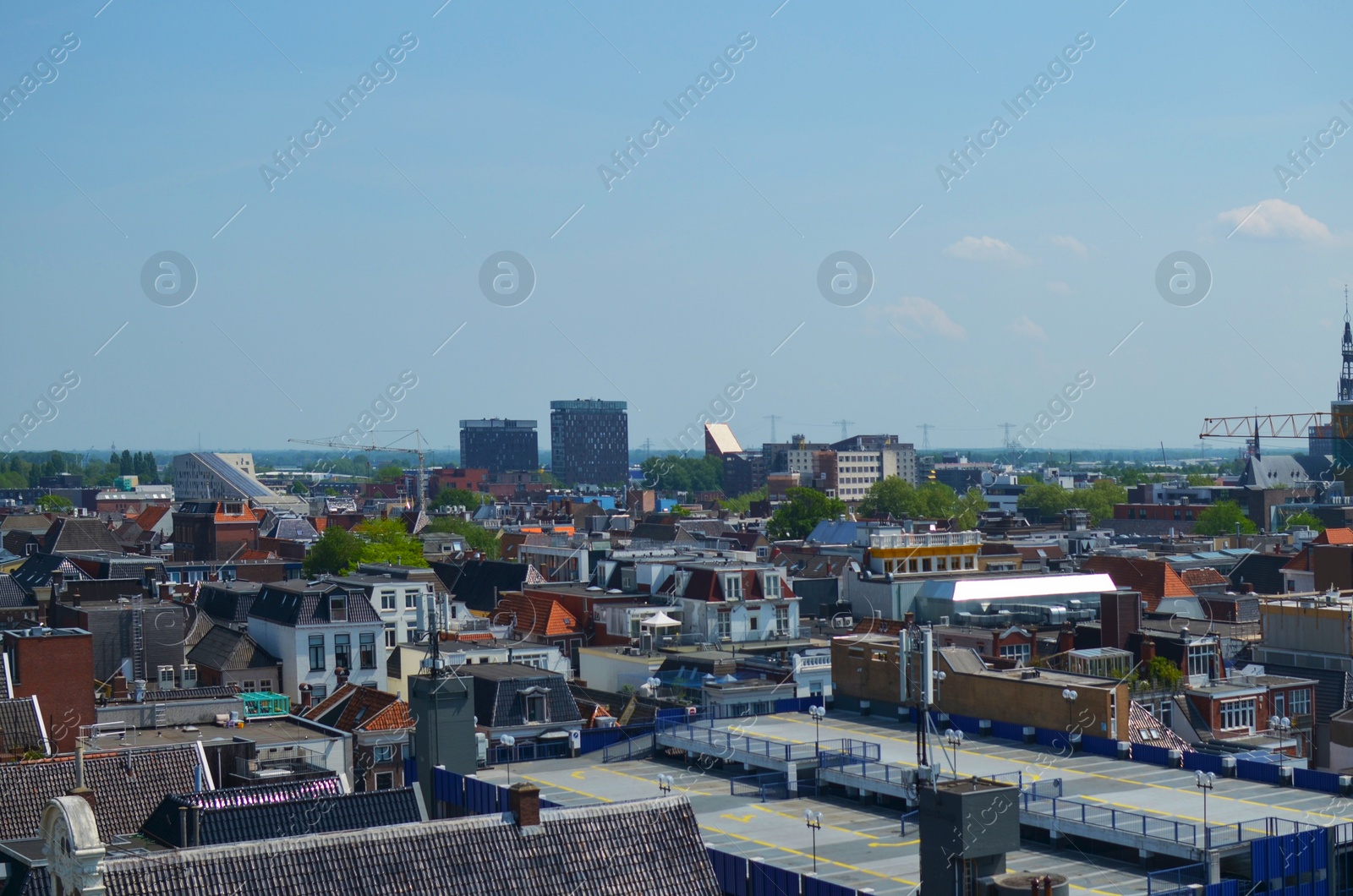 Photo of Picturesque view of city with beautiful buildings under blue sky