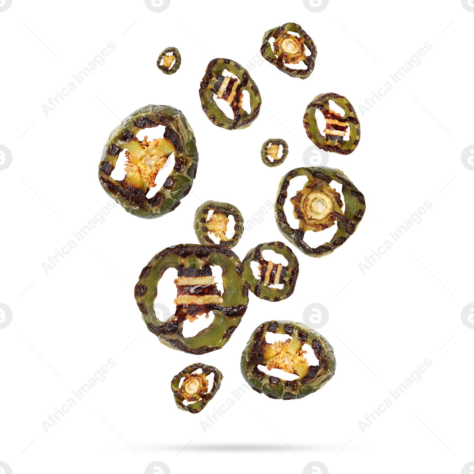 Image of Slices of grilled bell peppers in air on white background