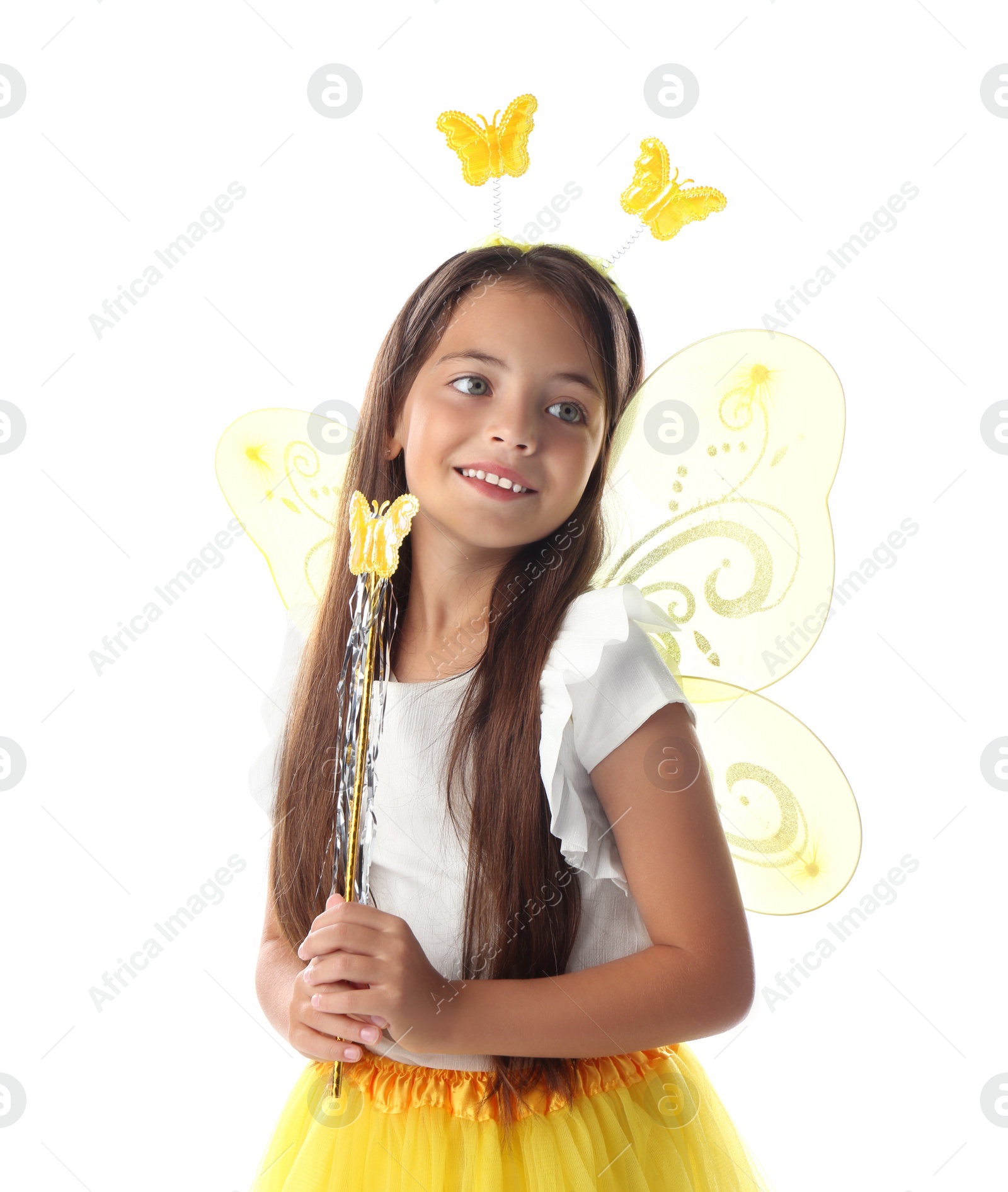 Photo of Cute little girl in fairy costume with yellow wings and magic wand on white background
