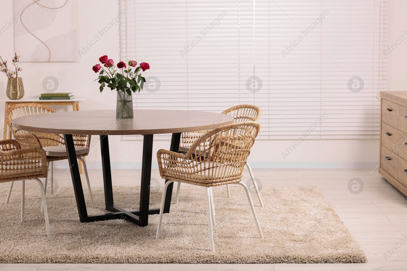 Photo of Stylish dining room interior with comfortable furniture. Space for text