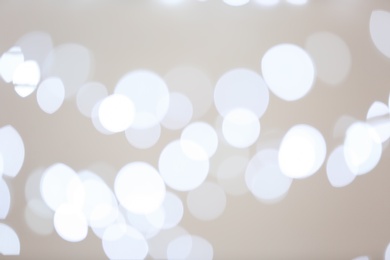 Photo of Blurred view of beautiful lights on gray background