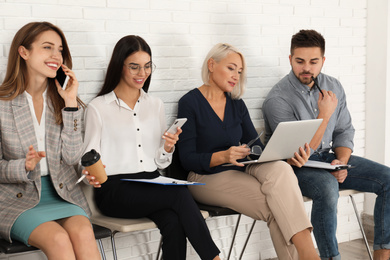 People waiting for job interview in office