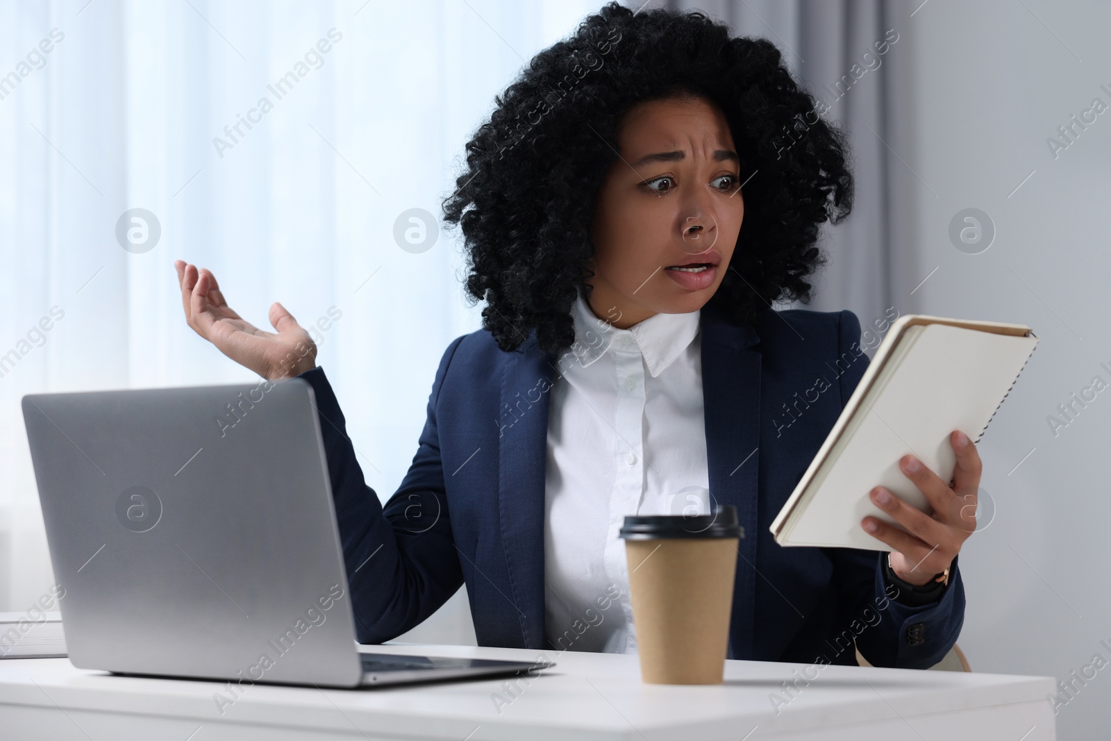 Photo of Deadline concept. Scared woman with notepad in office