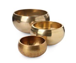 Photo of Three Tibetan singing bowls on white background