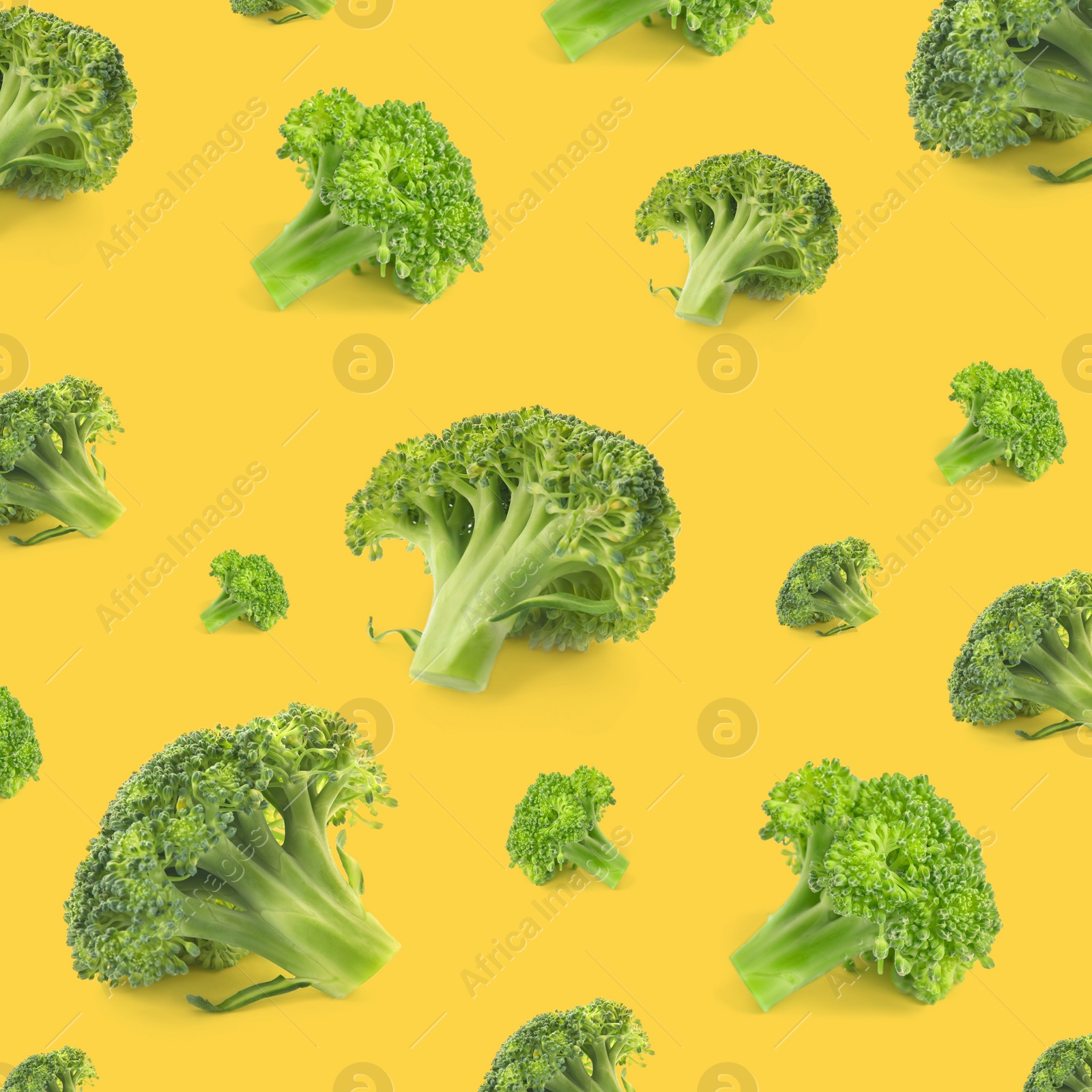 Image of Pattern of fresh green broccoli on orange background