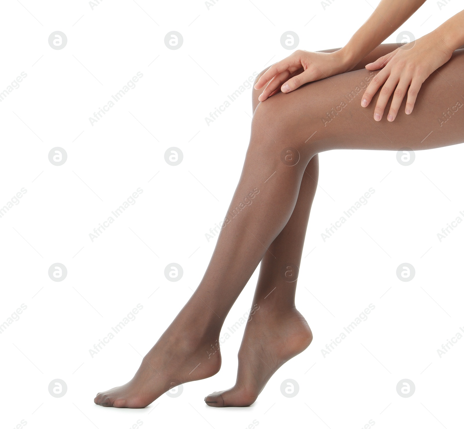 Photo of Legs of beautiful young woman in tights on white background, closeup