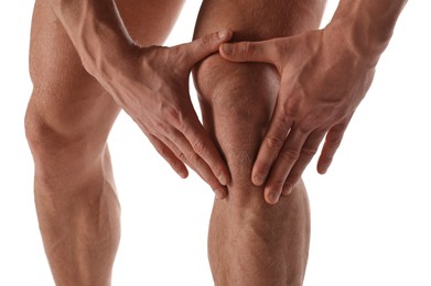 Man with muscular legs on white background, closeup