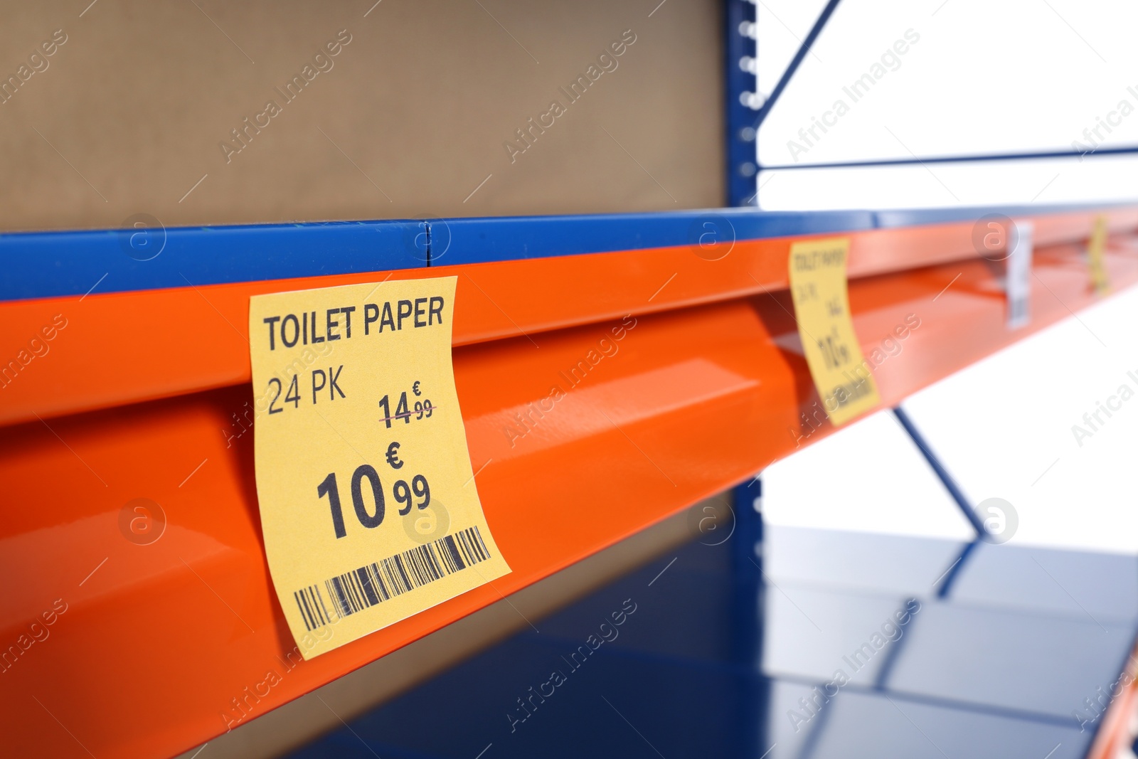 Photo of Empty market shelves on white background, closeup. Product deficiency due to social panic