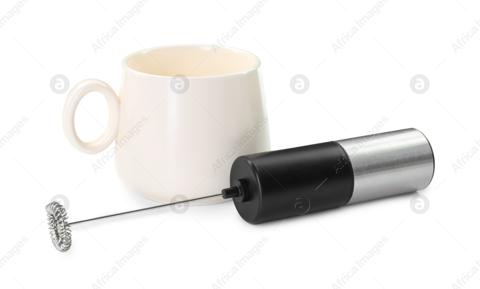 Photo of Milk frother wand and cup isolated on white