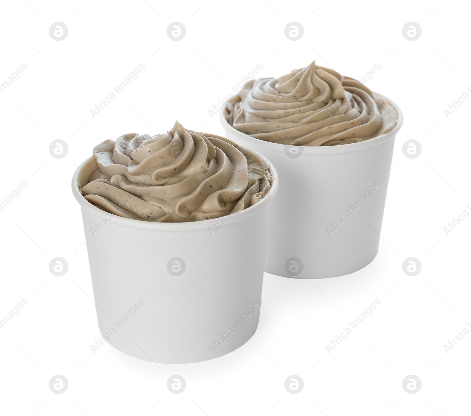 Photo of Cups with tasty frozen yogurt on white background