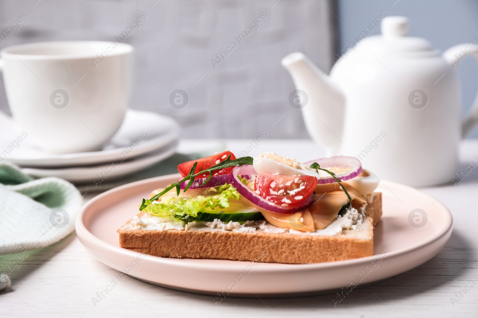 Photo of Delicious sandwich served on white wooden table