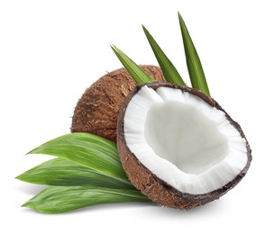 Image of Tasty ripe coconuts and green leaves on white background