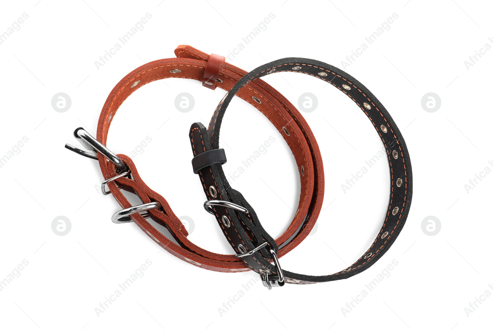 Photo of Different leather dog collars on white background, top view