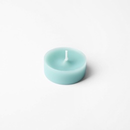 Light blue wax decorative candle isolated on white