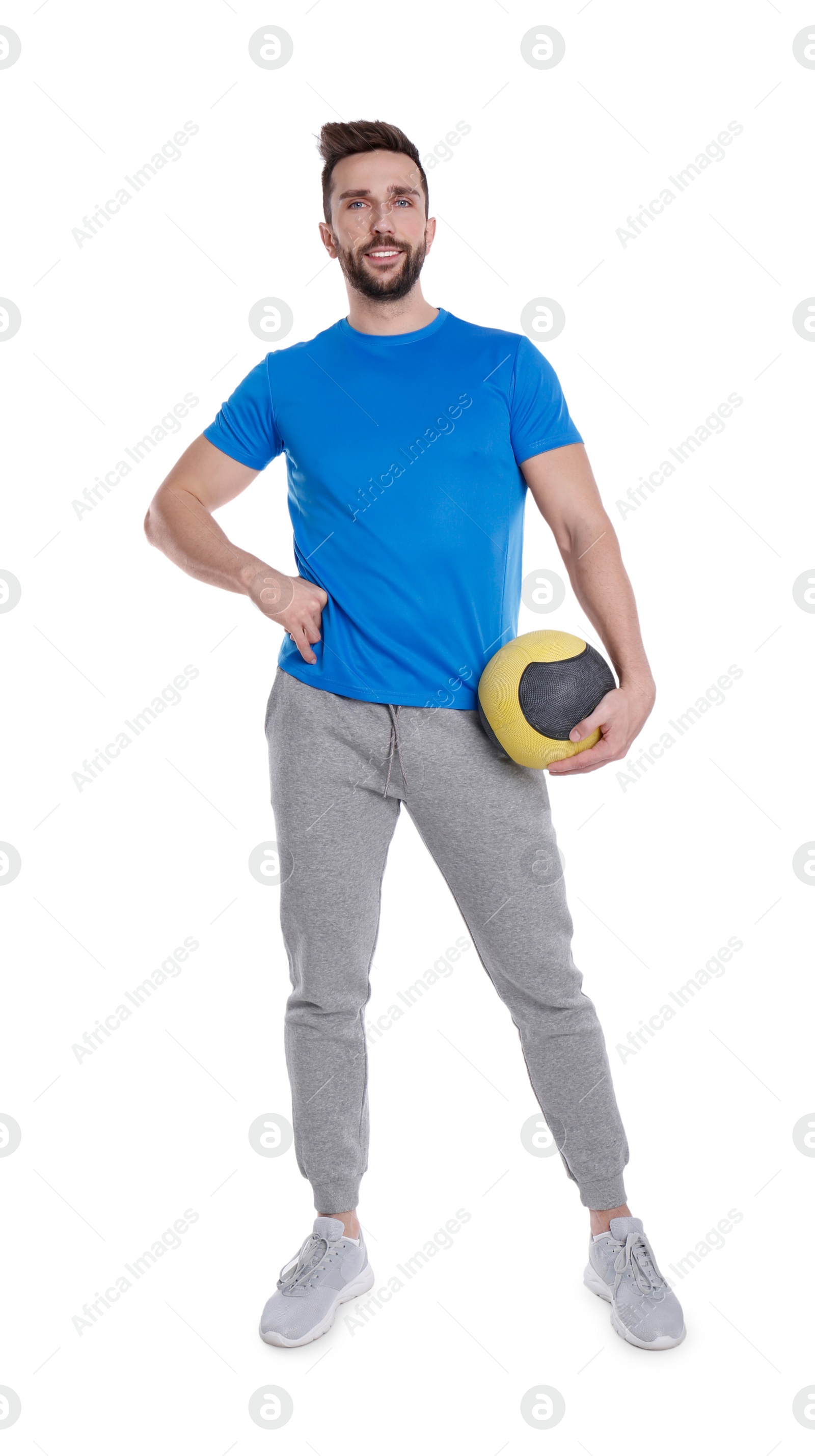 Photo of Athletic man with medicine ball isolated on white