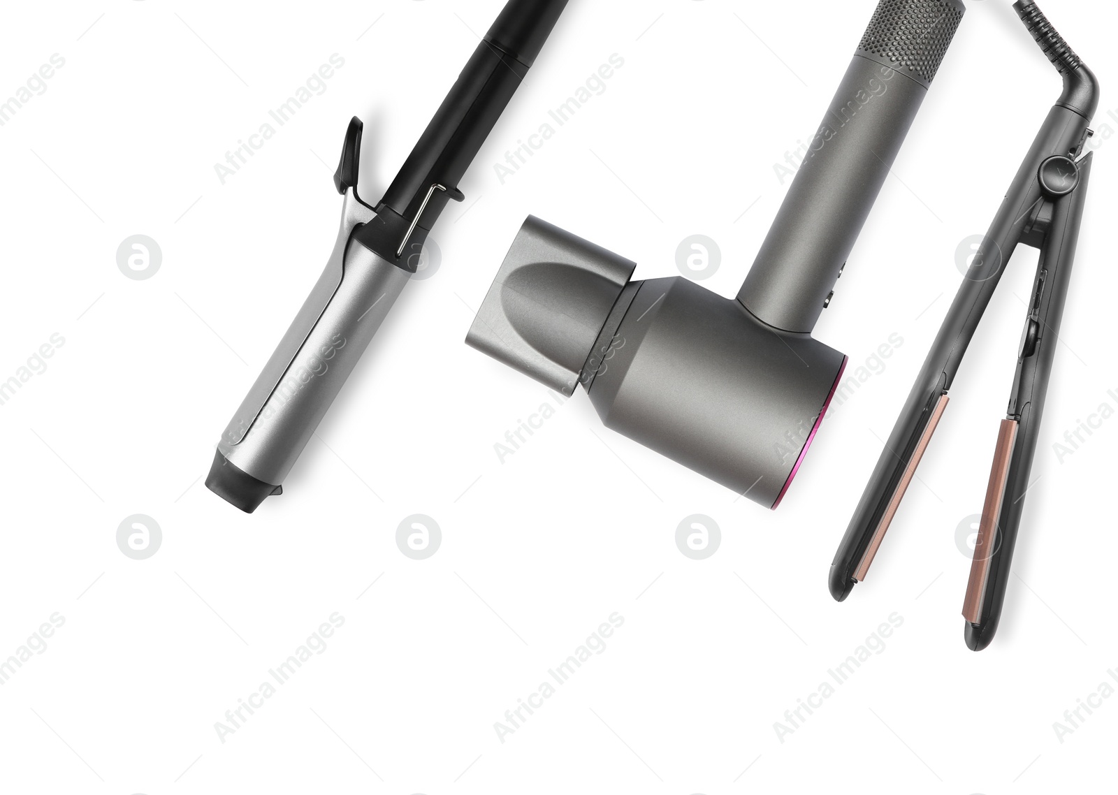 Image of Hair dryer, straightener and curling iron on white background, top view