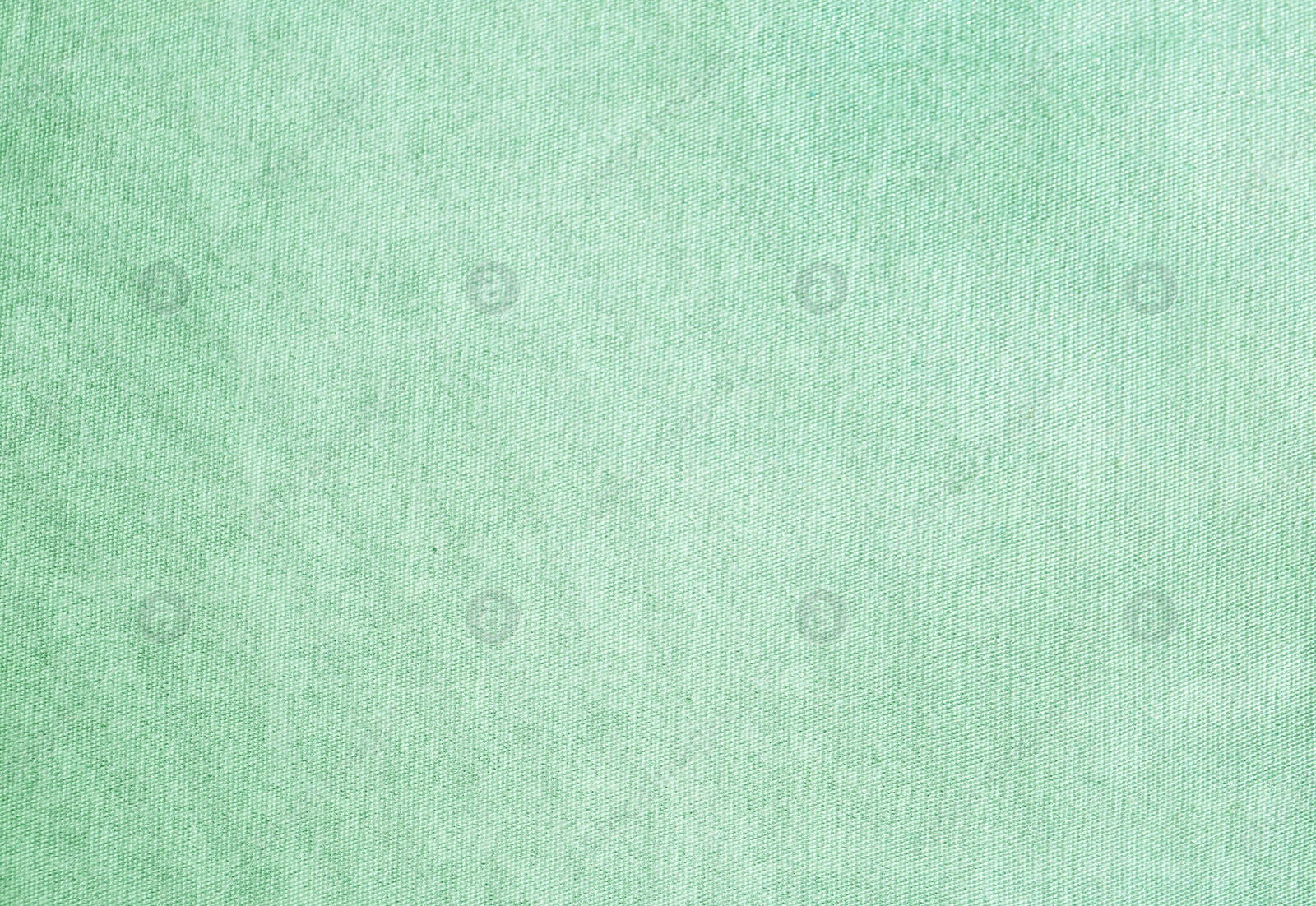 Image of Texture of delicate fabric as background. Image toned in mint color 