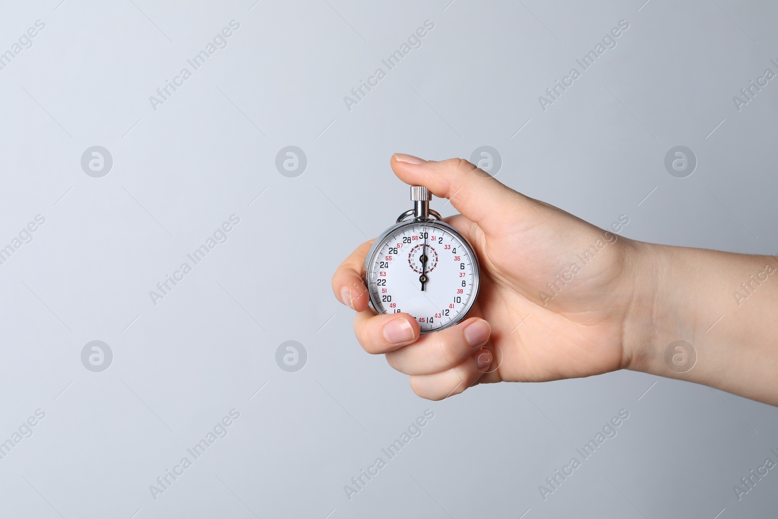 Photo of Woman holding vintage timer on white background, closeup. Space for text