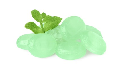 Photo of Many light green cough drops with mint on white background