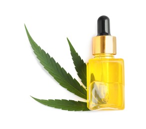 Photo of Bottle of hemp oil and leaf on white background, top view